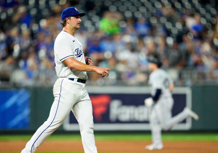 Sep 17, 2021; Kansas City, Missouri, USA; Kansas City Royals starting pitcher Jon Heasley (left) reacts after giving up a two-run home run to Seattle Mariners center fielder Jarred Kelenic (right) during the fourth inning at Kauffman Stadium. Mandatory Credit: Jay Biggerstaff-USA TODAY Sports